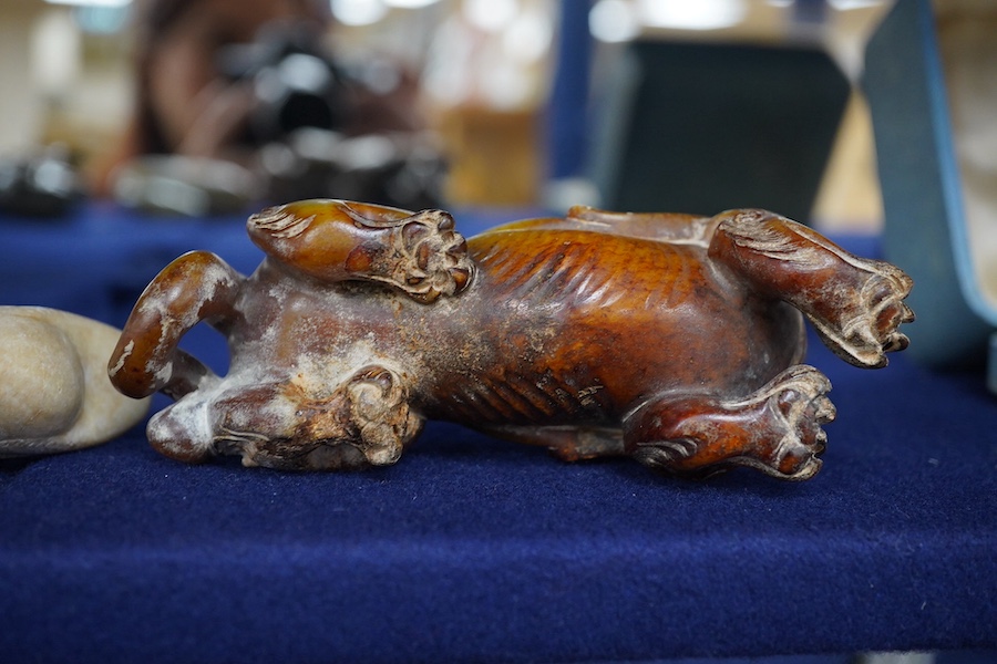 Three Chinese archaistic jade carvings of a winged mythical beast, a duck and a horned seated beast, one stand, largest 13cm wide, 7.5cm high. Condition - good.